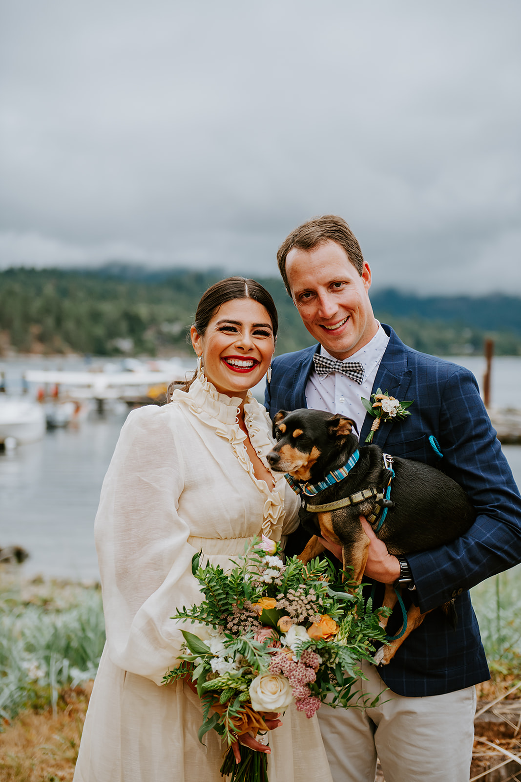 Bride and groom portrait with pet