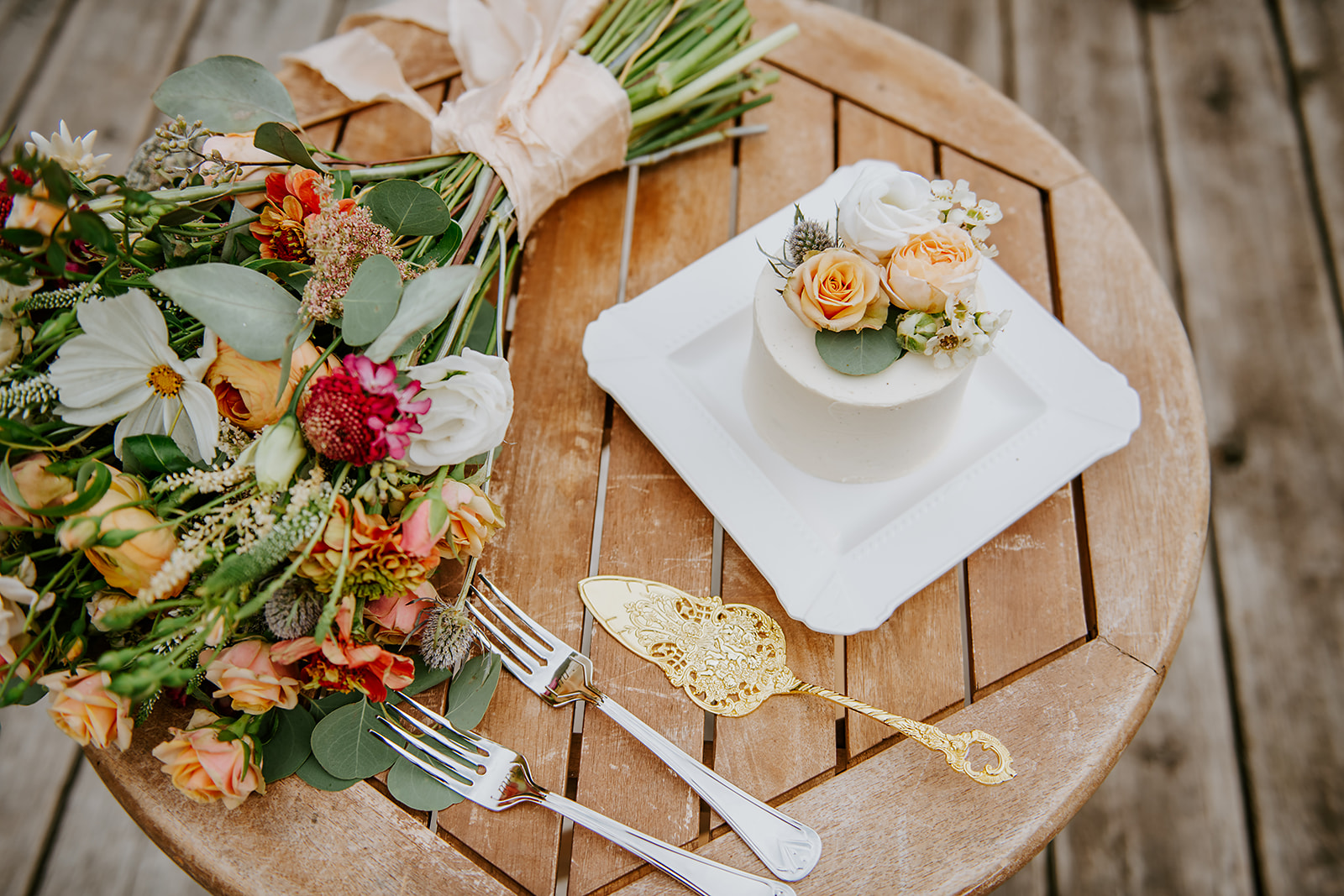 Petite wedding cake and bridal bouquet