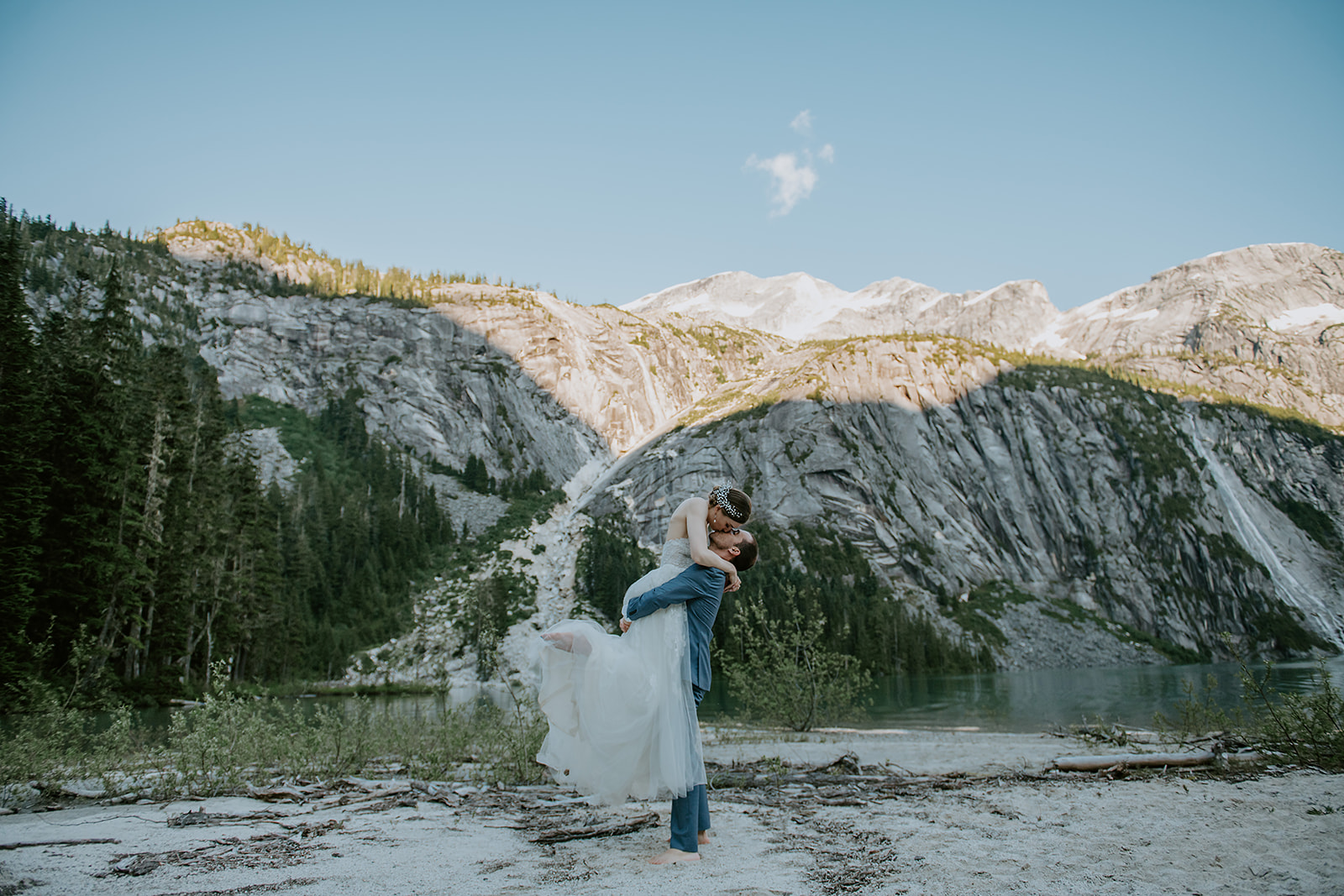Adventure elopement couple at an Alpine glacial lake