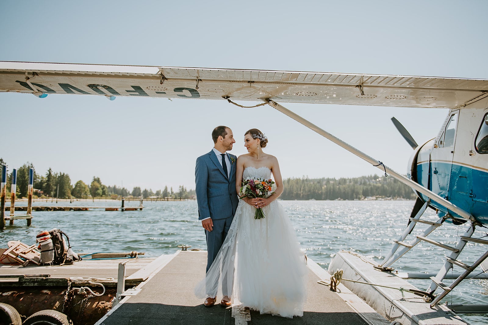 bride and groom with floatplane