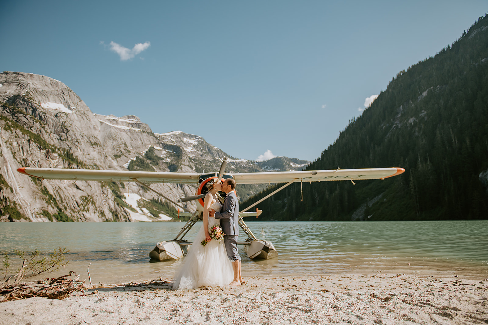 Bride and groom with floatplane